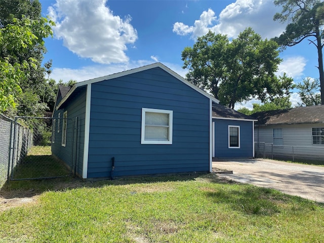 rear view of property with a yard