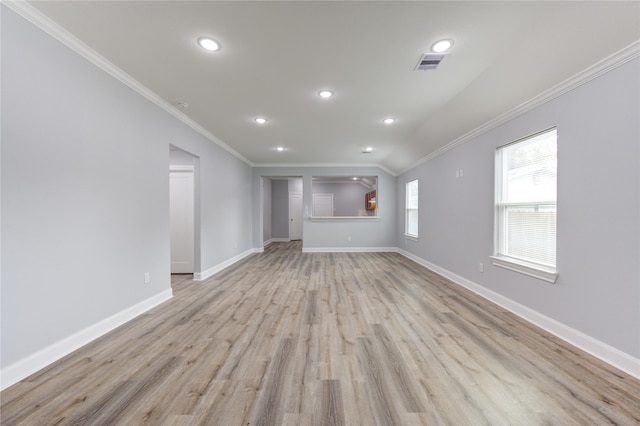 unfurnished living room with crown molding and light wood-type flooring