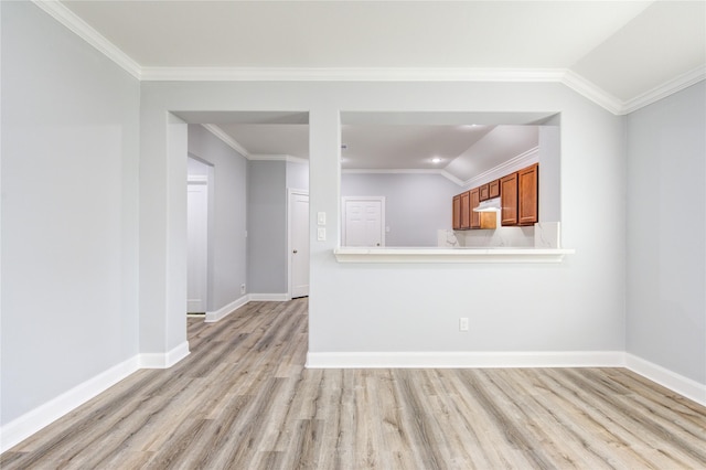 unfurnished living room featuring light wood-type flooring, vaulted ceiling, and ornamental molding