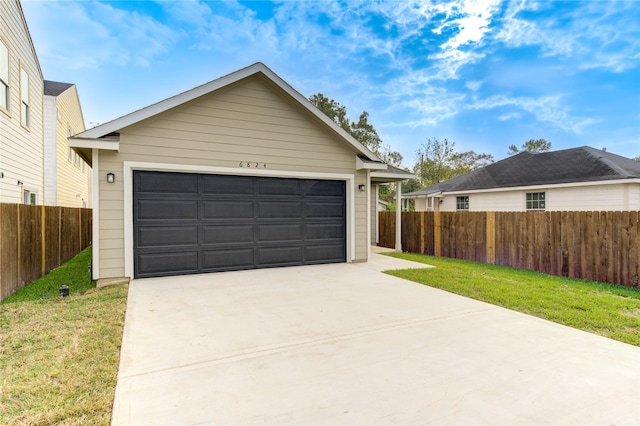 garage featuring a yard