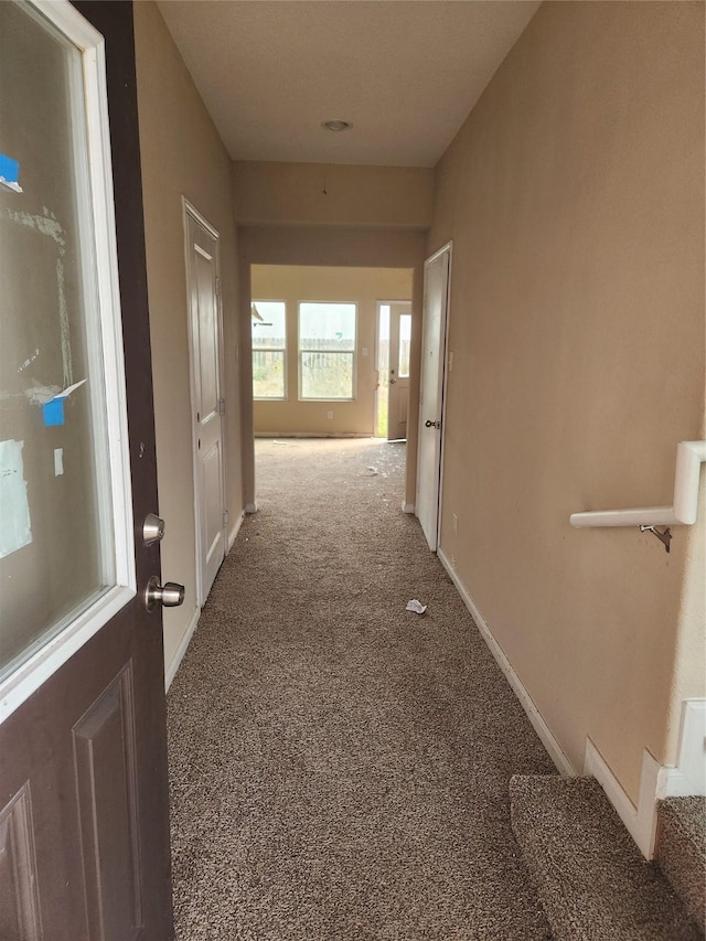 corridor with carpet floors