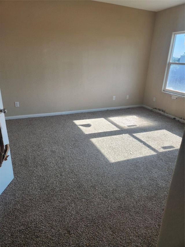 view of carpeted spare room