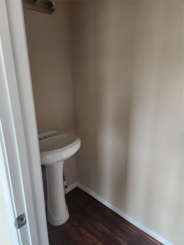 bathroom with hardwood / wood-style flooring