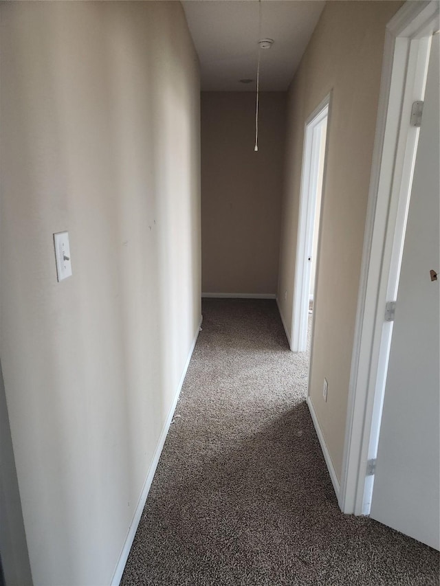 hallway with carpet floors