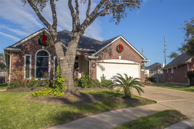 view of front facade featuring central AC unit, a garage, and a front yard