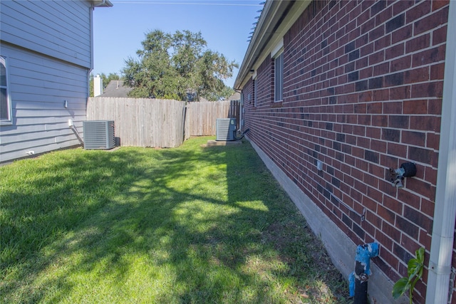 view of yard with central air condition unit