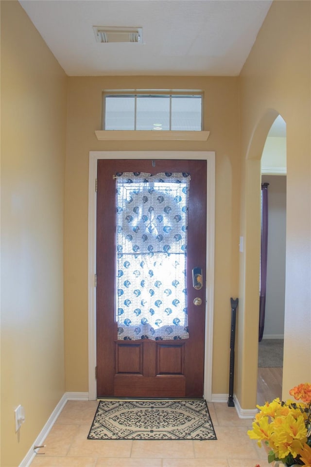 foyer with light tile patterned floors