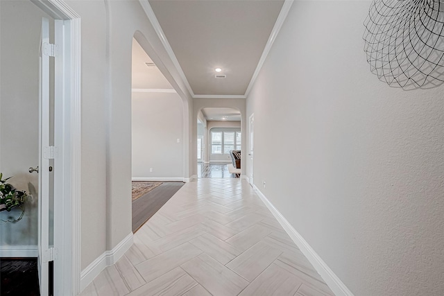 hallway featuring crown molding