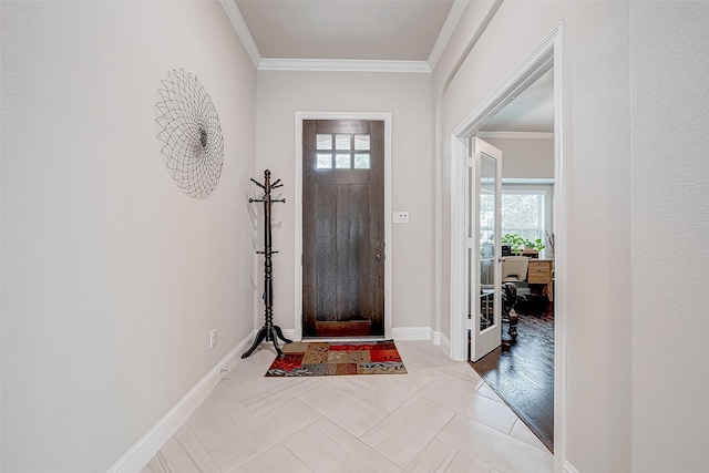 entrance foyer featuring plenty of natural light, crown molding, and light hardwood / wood-style flooring