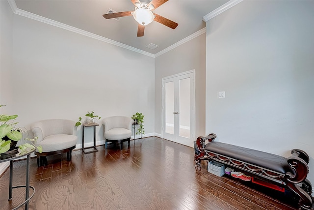 sitting room featuring ceiling fan, french doors, wood-type flooring, and ornamental molding