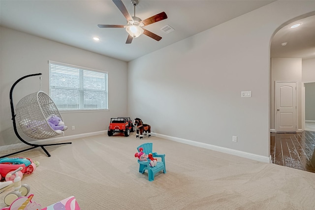 game room featuring carpet flooring and ceiling fan