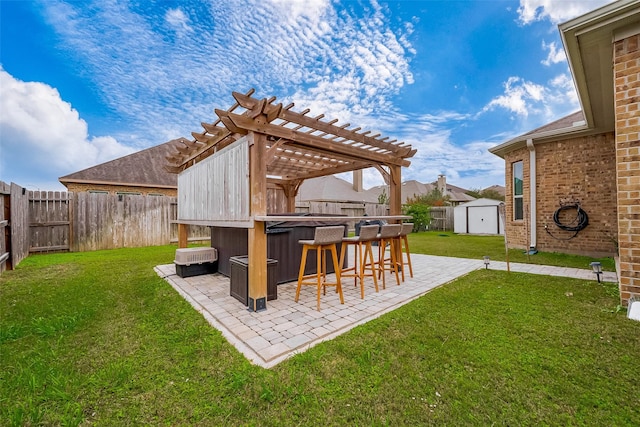 view of yard with a pergola, a bar, a patio, and a hot tub