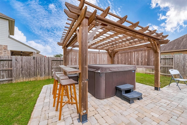 view of patio with a pergola and a hot tub