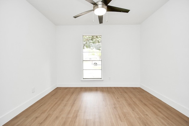 empty room featuring ceiling fan and light wood-type flooring