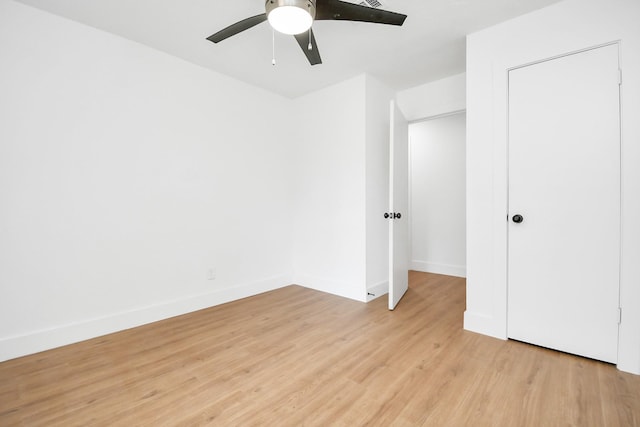 unfurnished bedroom featuring ceiling fan and light hardwood / wood-style flooring