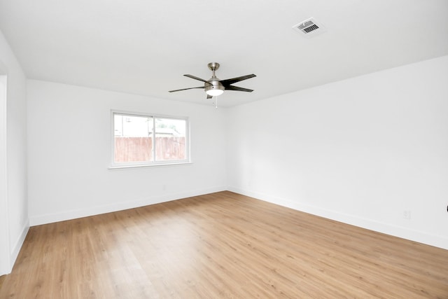 empty room featuring ceiling fan and light wood-type flooring