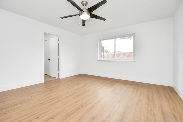 empty room featuring ceiling fan and light wood-type flooring