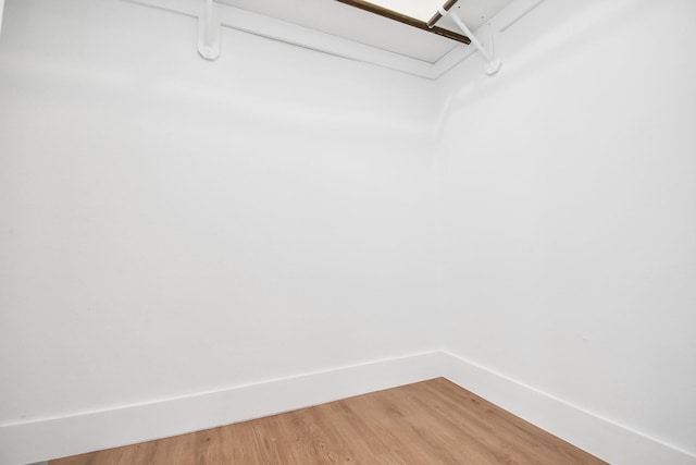 walk in closet featuring hardwood / wood-style flooring