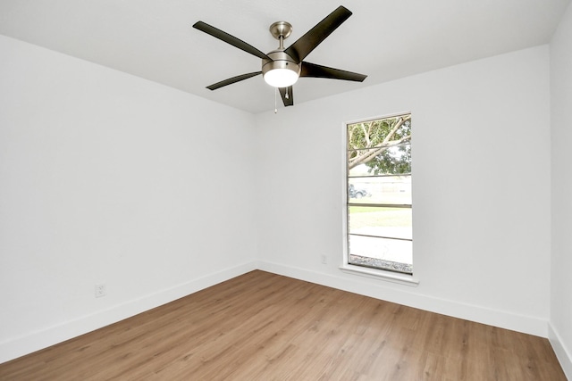 spare room featuring ceiling fan and light hardwood / wood-style floors