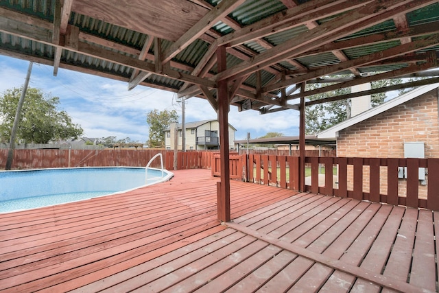 deck with a fenced in pool