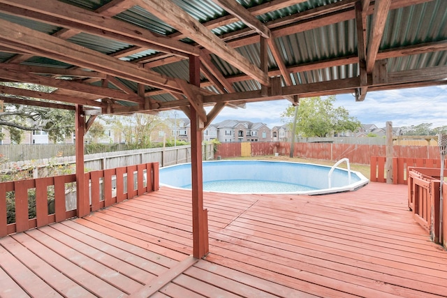 view of swimming pool with a deck