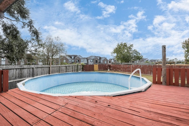 view of pool with a wooden deck