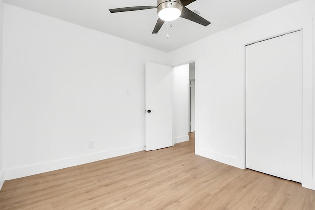 unfurnished bedroom featuring ceiling fan and light hardwood / wood-style flooring