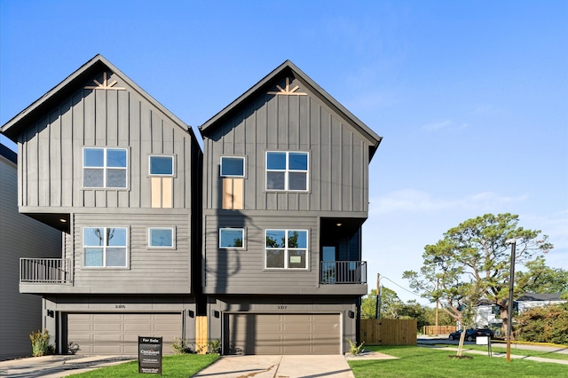 view of front of home featuring a balcony, a front lawn, and a garage