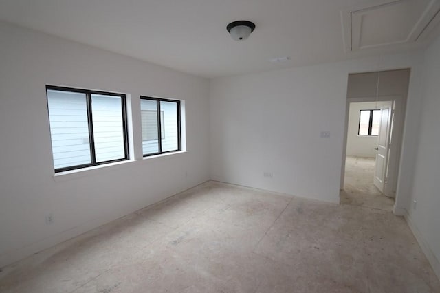 spare room featuring attic access