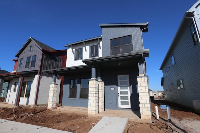 view of front of house with brick siding