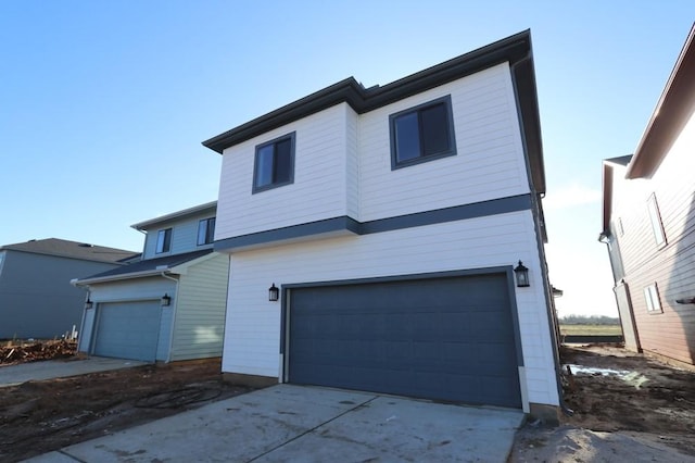 view of front of home featuring driveway and an attached garage