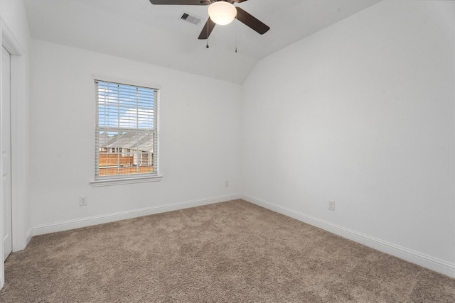 empty room with carpet floors, ceiling fan, and lofted ceiling