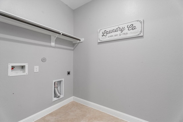 laundry area featuring hookup for an electric dryer, washer hookup, hookup for a gas dryer, and light tile patterned flooring