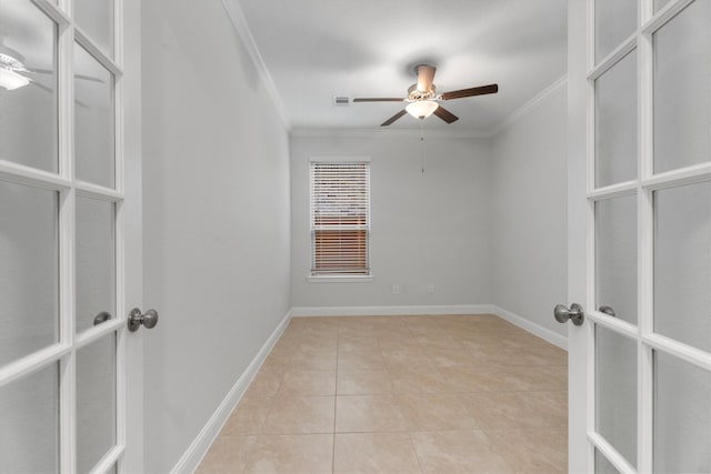 empty room featuring ceiling fan, light tile patterned floors, crown molding, and french doors