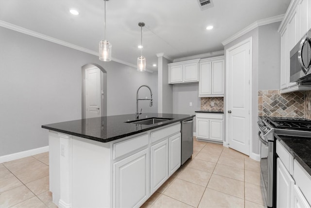 kitchen featuring white cabinetry, sink, an island with sink, and appliances with stainless steel finishes