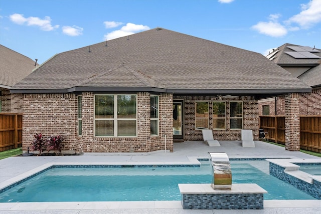 view of pool with an in ground hot tub and a patio area