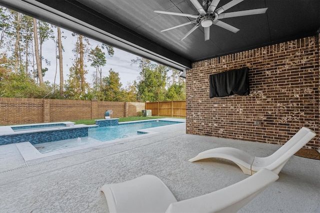 view of swimming pool with an in ground hot tub