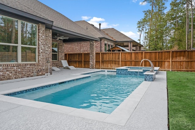 view of pool with an in ground hot tub, ceiling fan, and a patio