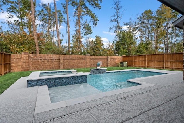 view of swimming pool with an in ground hot tub