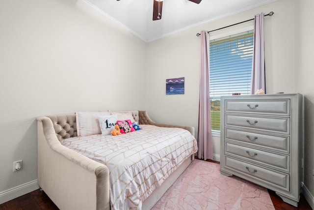 bedroom with light hardwood / wood-style flooring, ceiling fan, and crown molding