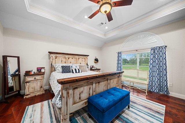 bedroom featuring a raised ceiling, ceiling fan, dark hardwood / wood-style floors, and ornamental molding