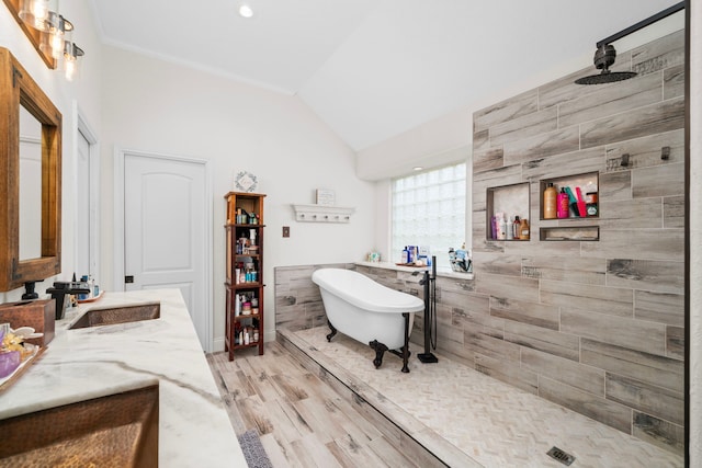 bathroom featuring hardwood / wood-style floors, vanity, independent shower and bath, and lofted ceiling