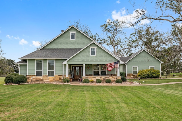 view of front facade with a front lawn and a porch