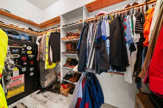 spacious closet featuring light hardwood / wood-style floors