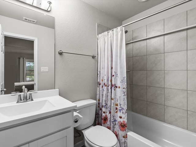 full bathroom featuring vanity, shower / bath combo, and toilet