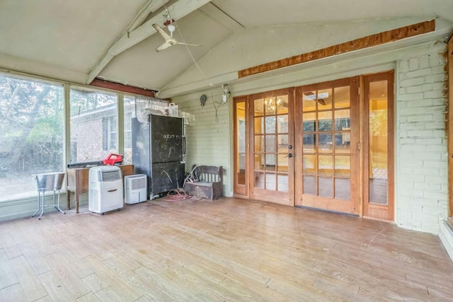 unfurnished sunroom with french doors, lofted ceiling with beams, and ceiling fan