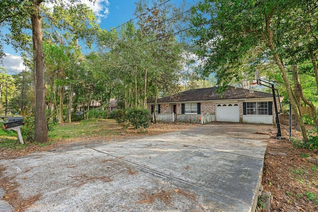 exterior space featuring covered porch and a garage