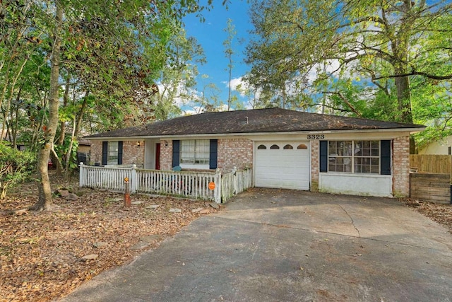 ranch-style house featuring covered porch and a garage