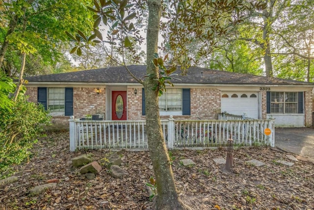 single story home featuring a garage