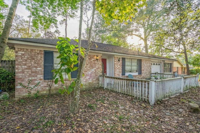 ranch-style home featuring a garage